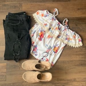 White off the shoulder top w/ a red floral pattern